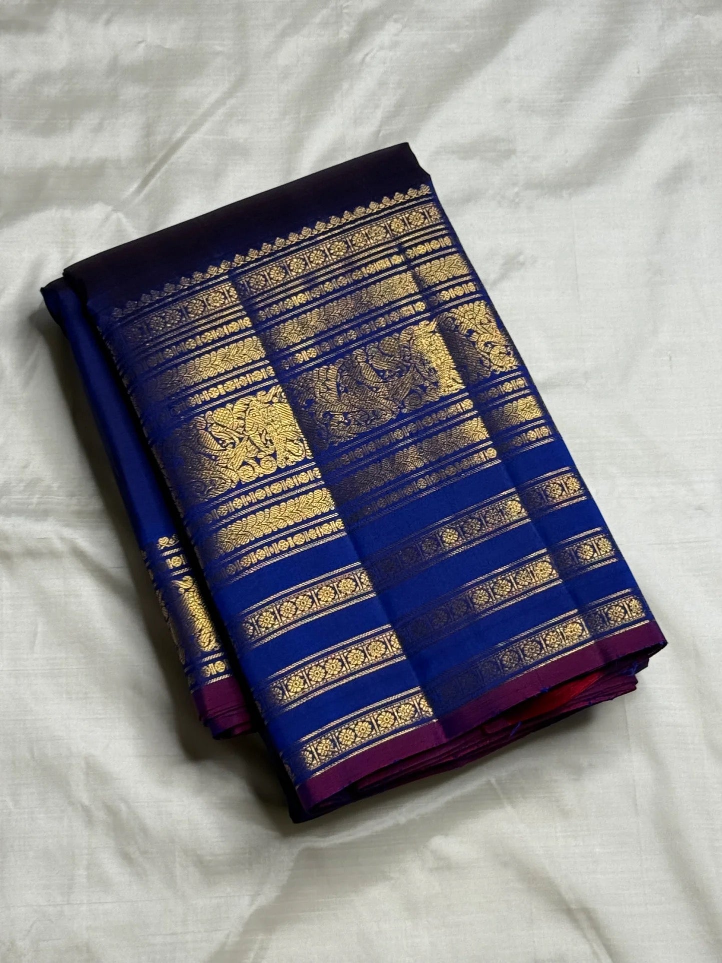 Close-up of maanga butta in gold zari on amethyst purple navy Kancheepuram silk saree — Idam Living