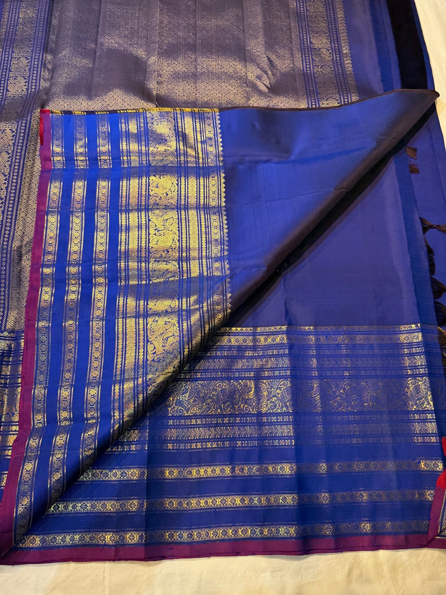Magenta selvedge and gold zari varisaipet border on amethyst purple navy Kanchipuram silk saree — Idam Living