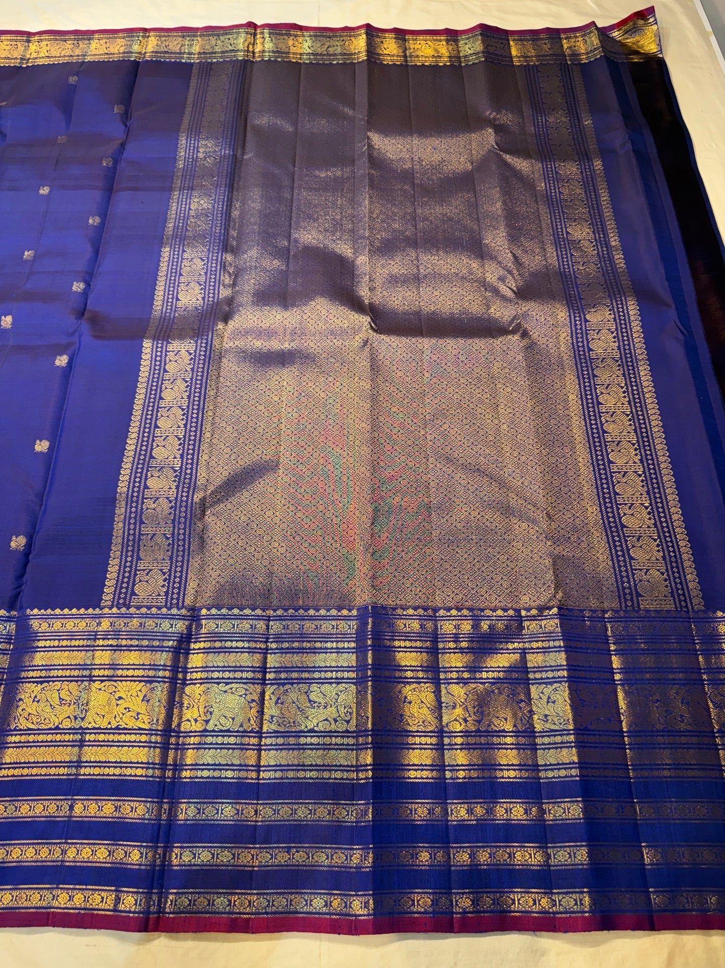 Varisaipet border with vanasringaram gold zari motifs on amethyst navy double shade Kanchipuram saree — Idam Living