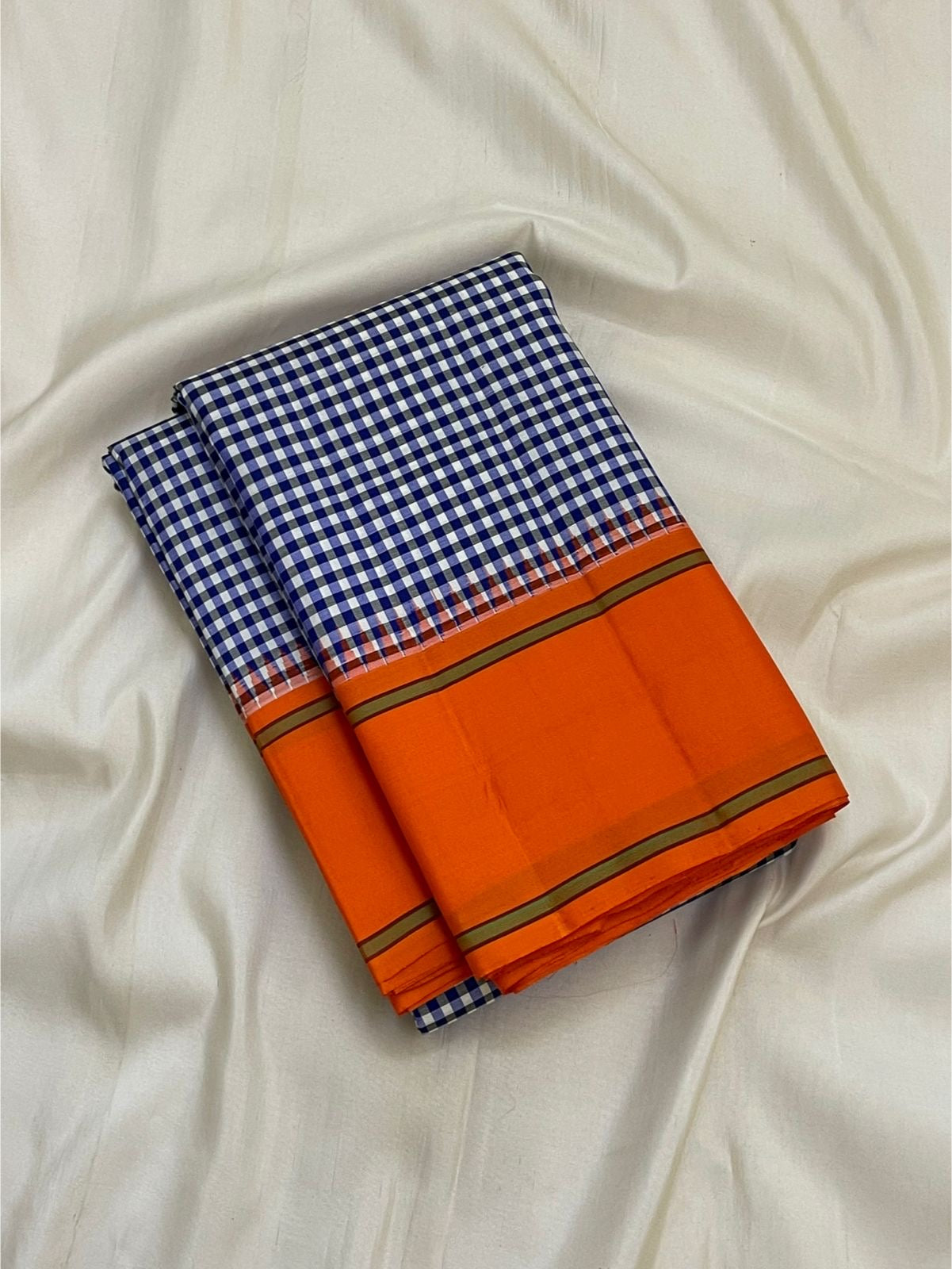 Orange Pillayar Reku Korvai border of navy white kattam Kancheepuram saree with Ganesha motif in antique gold zari
