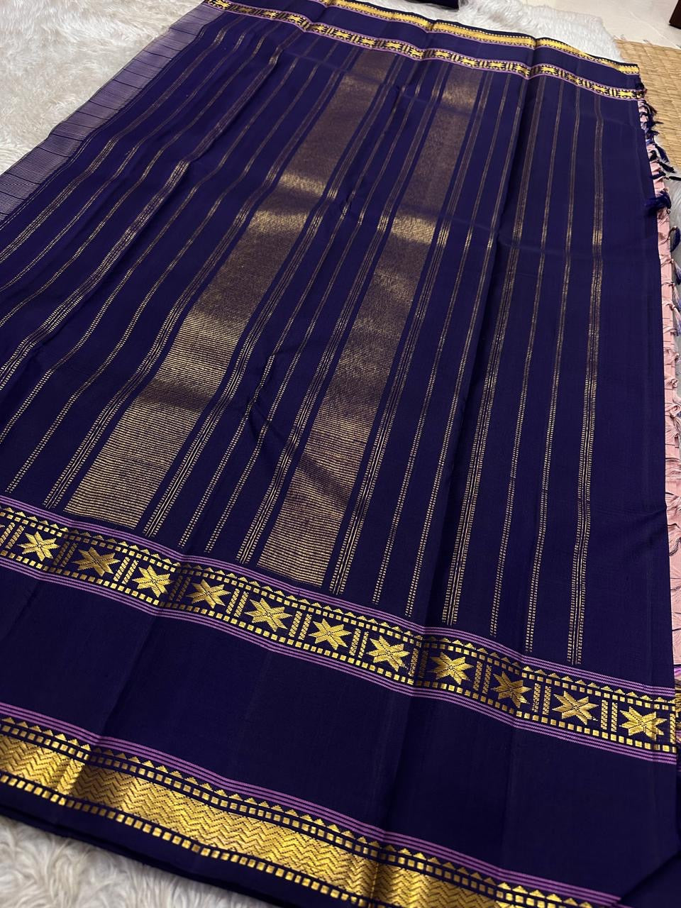 Full view of deep navy striped pallu and star zari border on pure Kanchipuram silk saree with tassels, shipped from New Jersey USA