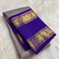 Handwoven pure silk Kanchipuram Rettapet saree in neelam blue with all-over gold zari lines.