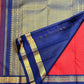 Neelam-blue Rettapet border with Rudhraksham-inspired motif bands on a deep vibrant red Pure Silk Kanchipuram saree.