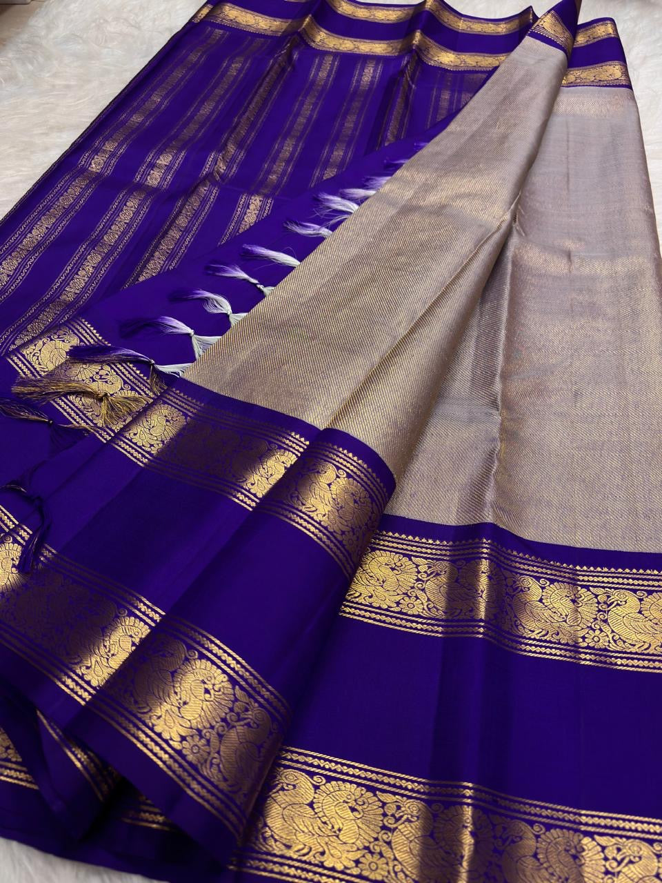 Neelam blue silk body detail showing repeated vertical zari lines.