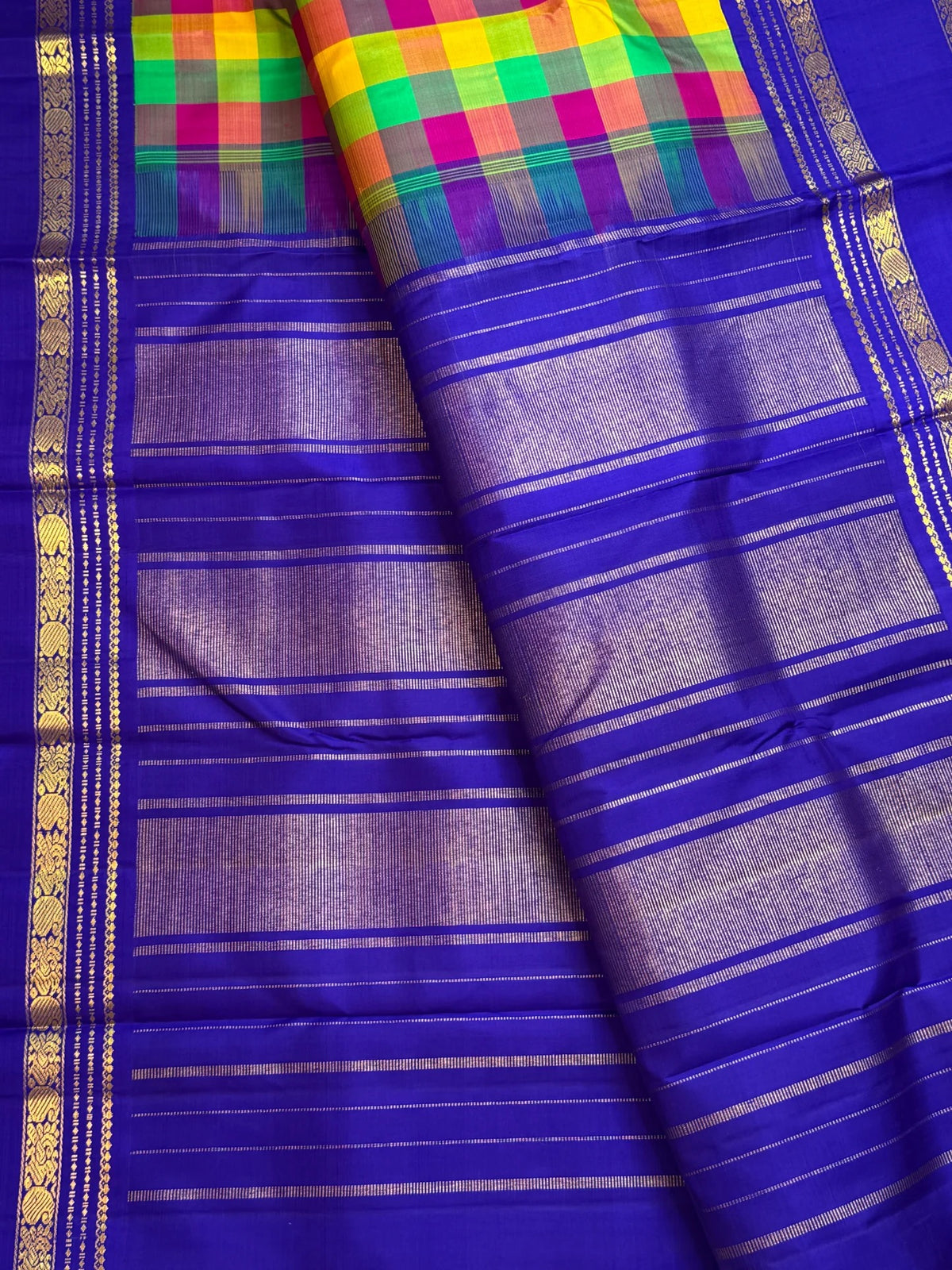 Jewel-toned Madras checks pallu of neelam blue Kanchipuram silk saree