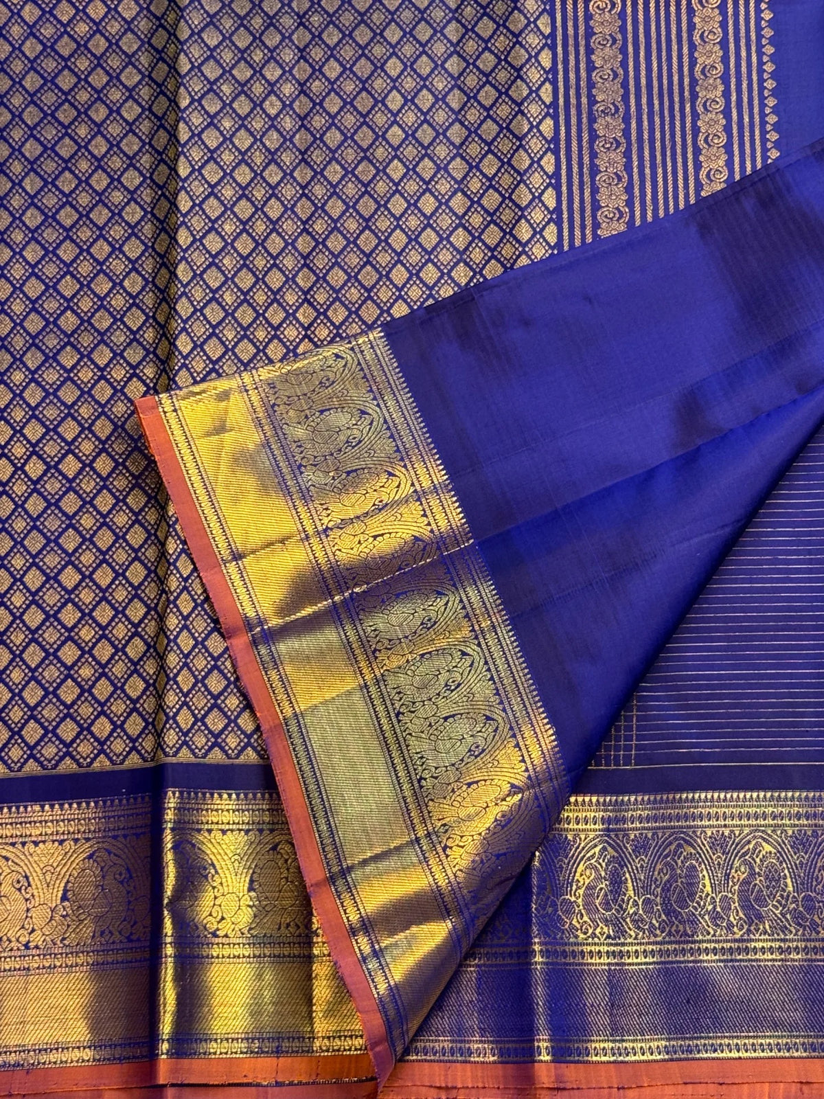 Fine gold zari grid over deep-blue Kanchipuram silk