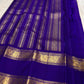 Layered gold Rettapet border on the blue silk saree.