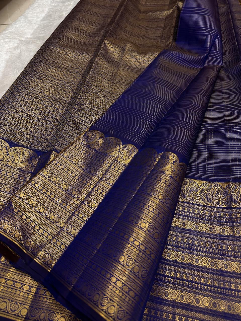 Handwoven Deep Neelam Pure Silk Kanchipuram with fine gold Kattam geometry.