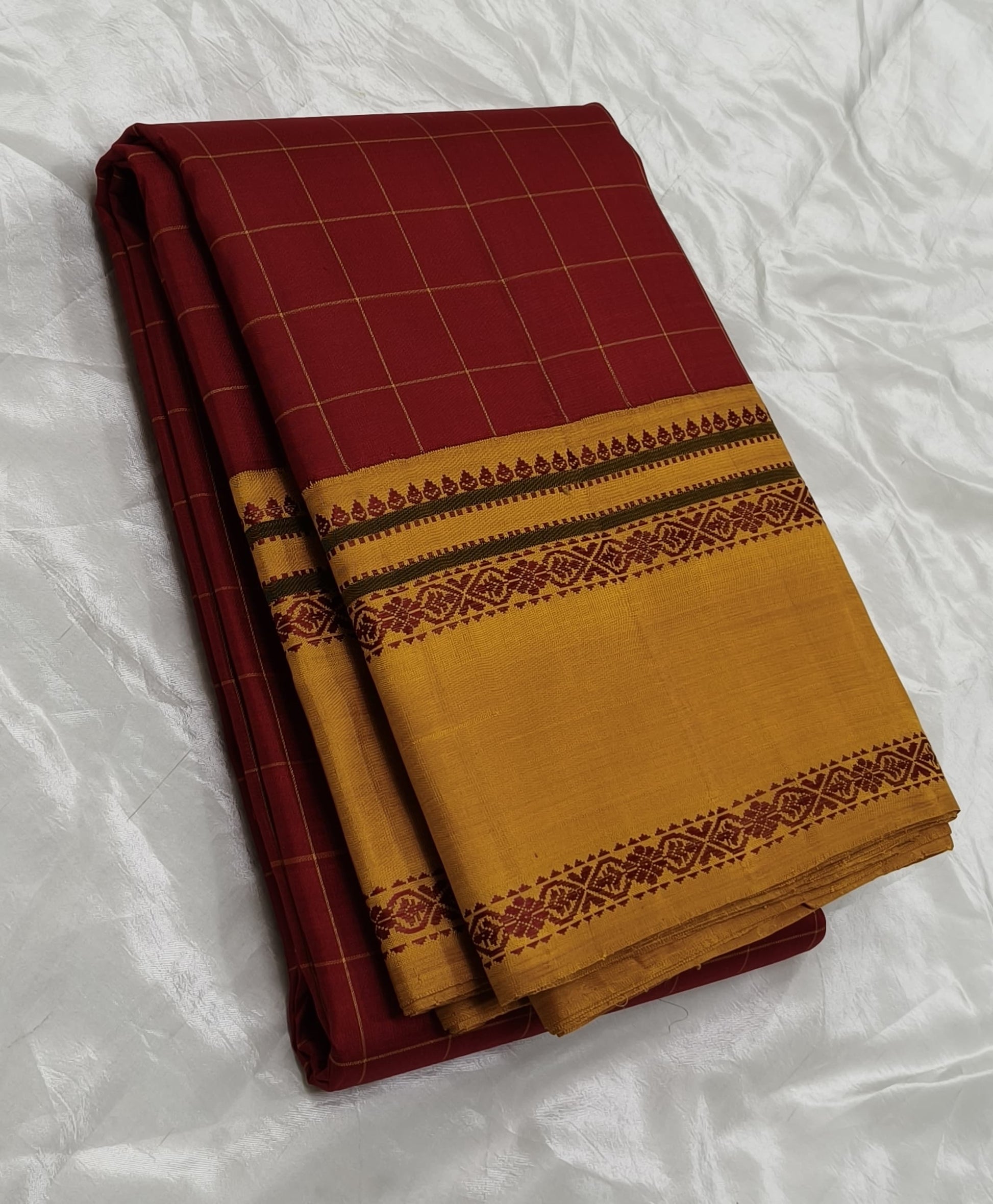 Deep sindoor red Kanjeevaram silk saree with silk thread woven border detailing