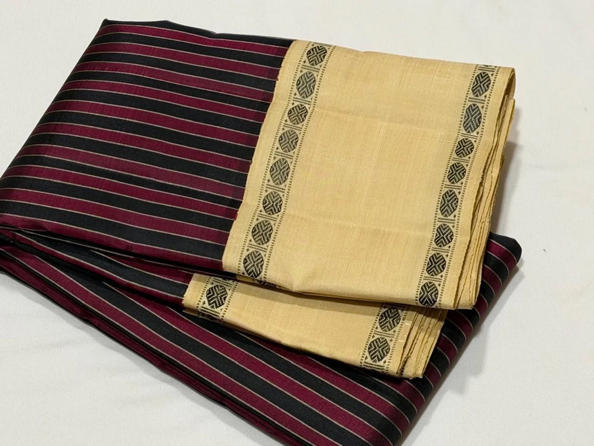 Closeup of the colour and border interplay on the Maroon and Black Striped Premium Zariless Korvai Kanjivaram Saree with Off White Rettapet Rudraksham Borders.