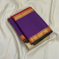 Folded pure Kanchipuram silk saree showing solid purple panel with red and gold zari woven border