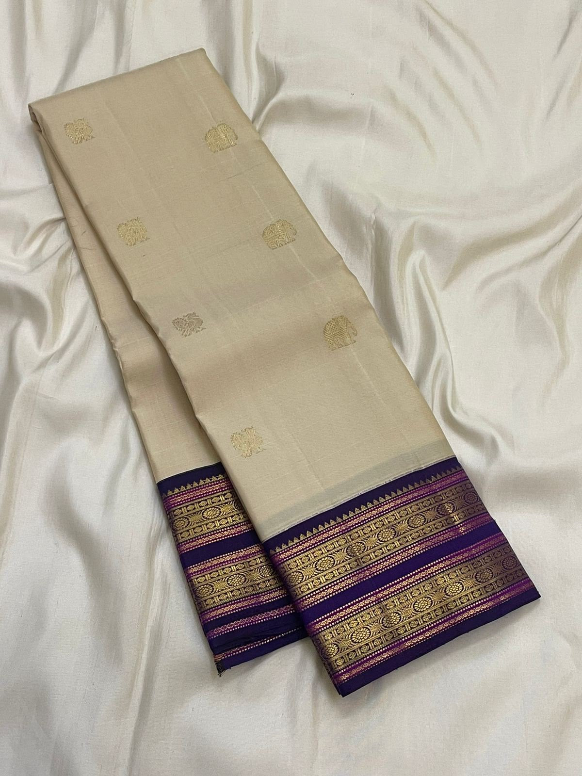 Off-white handwoven pure silk Kanchipuram saree with violet Rettapet border — Idam Living