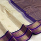Gold zari elephant motif close-up on off-white body