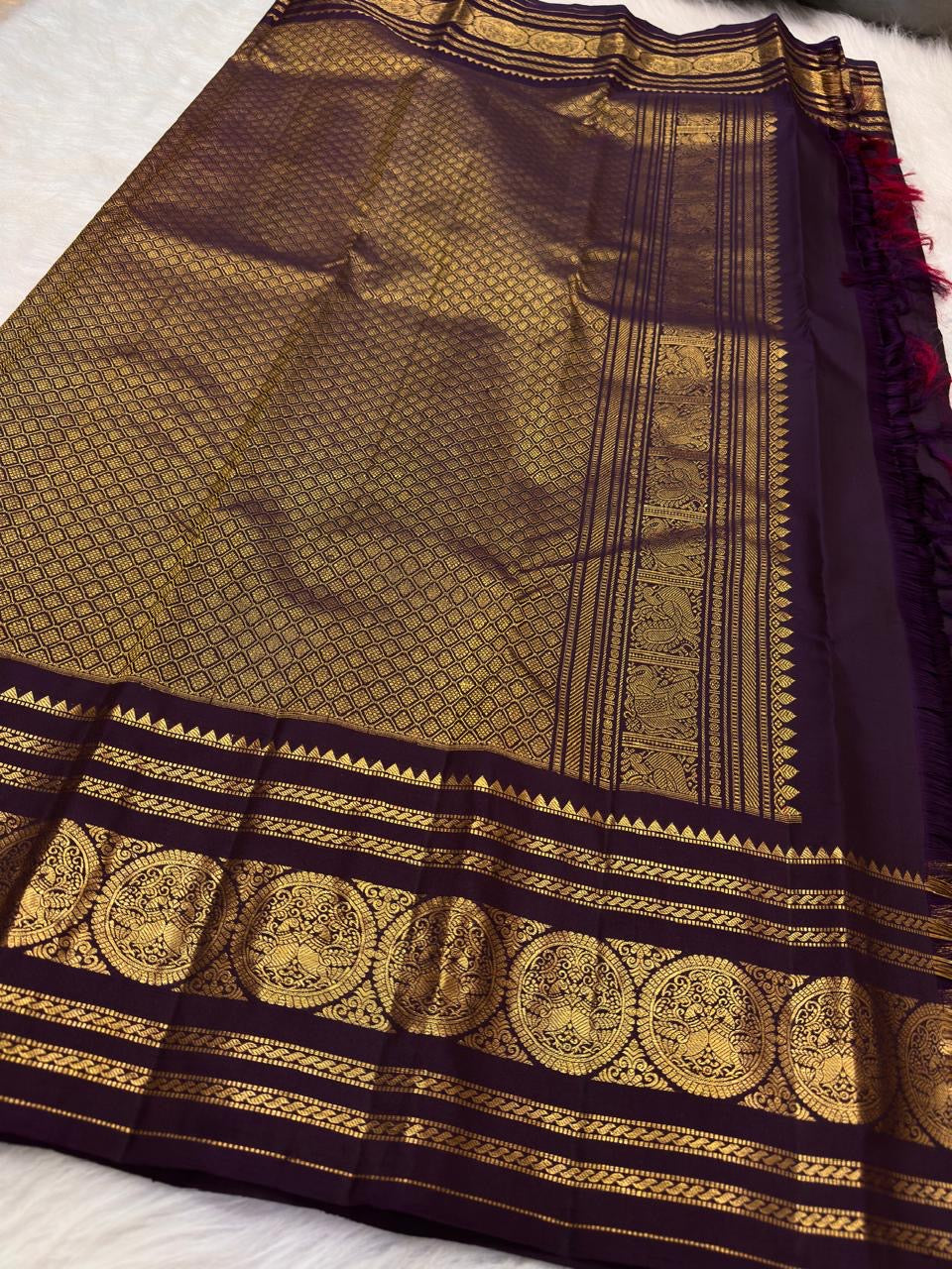Dusky Aubergine Handwoven Pure Silk Kancheepuram Saree with Mayil Zari Buttas and Antique Pon Zari Border