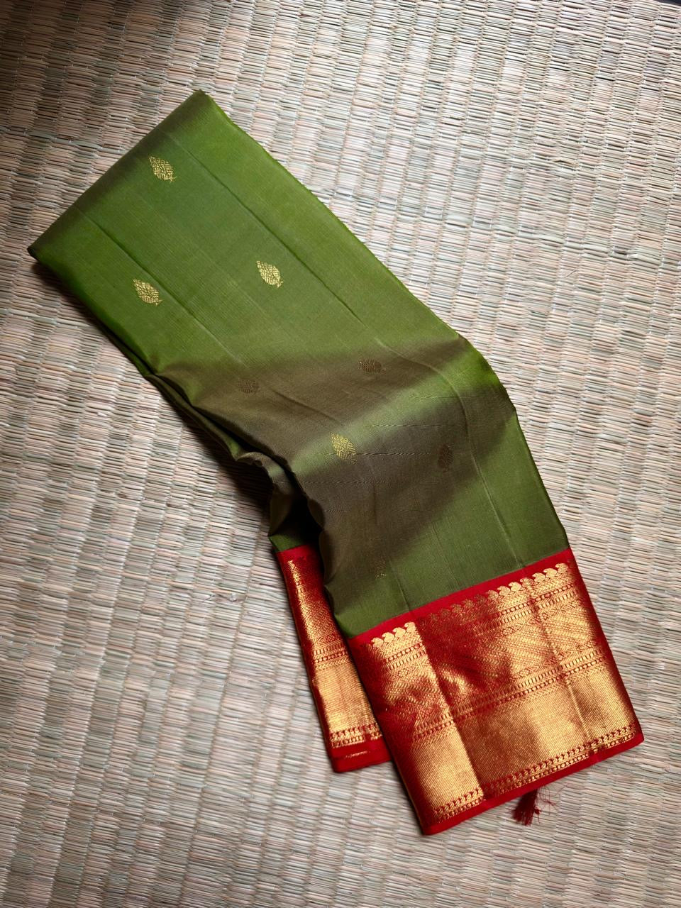 Olive Green Kanchipuram Korvai saree with Arakku Red contrast border.