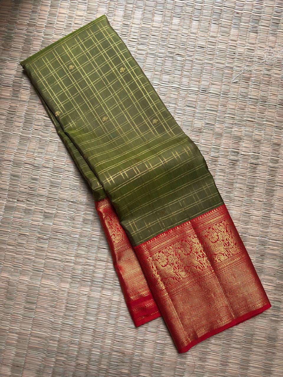 Olive Green Pure Silk Kanchipuram Zari Kattam saree with Arakku Red border.
