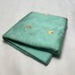 Detail of the slender Olive Green edge finishing the gold border on an Aqua Blue Chanderi silk saree
