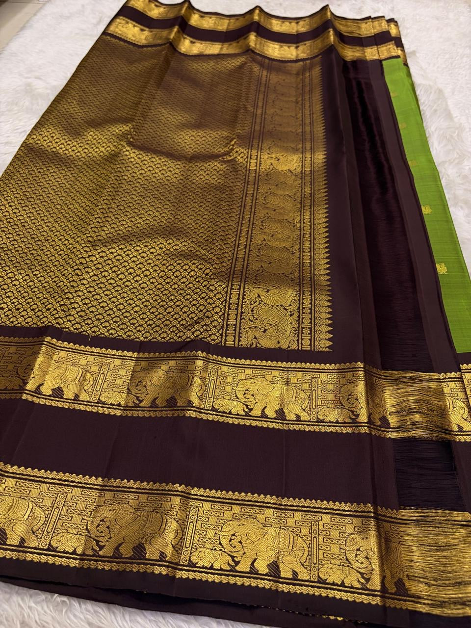 Handwoven olive green Kanchipuram silk saree draped view