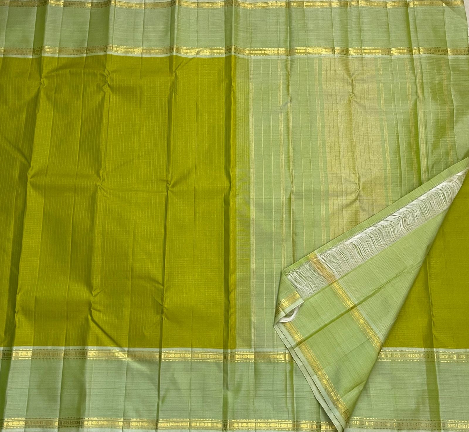 Gold zari border detail on olive green Kanchipuram pure silk saree — Idam Living