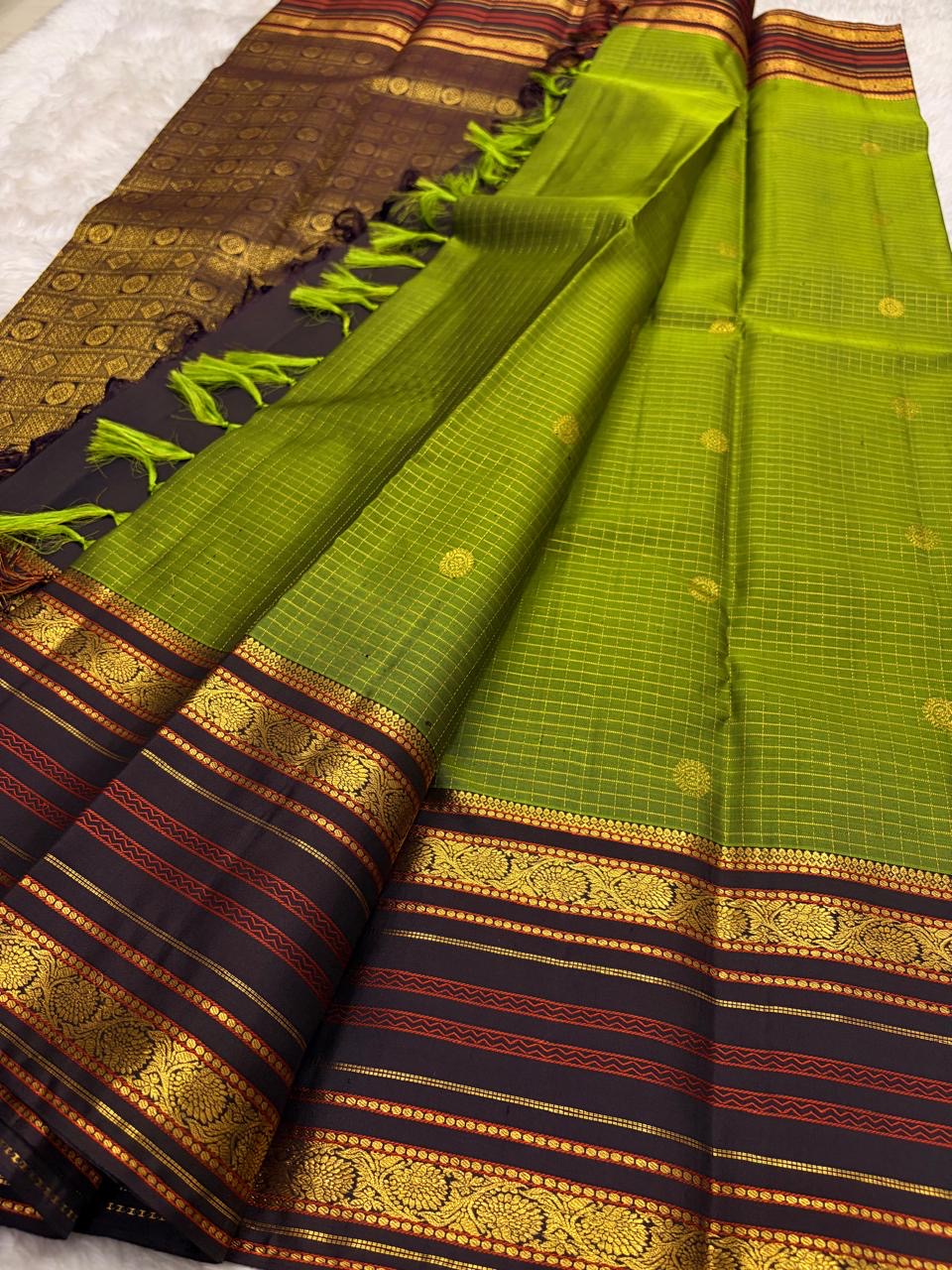 Olive green Kancheepuram silk saree with Varisaipet weave and deep black border — Idam Living