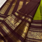 Gold mayil peacock buttas repeated between the other figured motifs on the green silk.