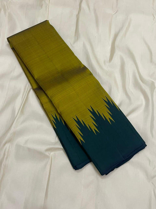 Lengthwise folded olive green Pure Kanchipuram Silk Saree showing forest green Thazampoo Reku edge