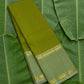 Olive green handwoven Kancheepuram pure silk saree with zari kattam body and sage korvai border on banana leaf — Idam Living