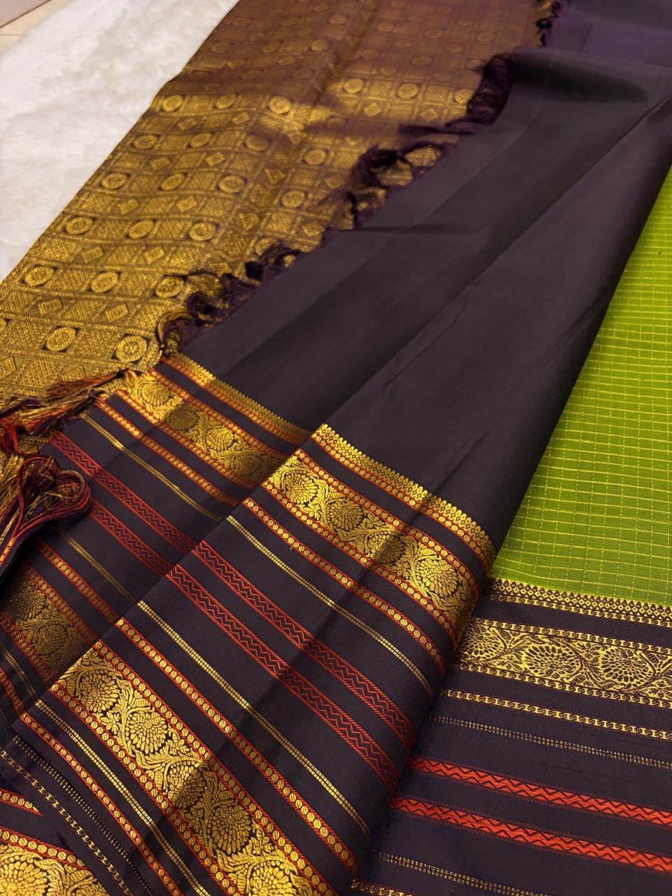 Olive green Pure Silk Kanjivaram Varisaipet saree showcasing refined grid weave and gold zari detailing