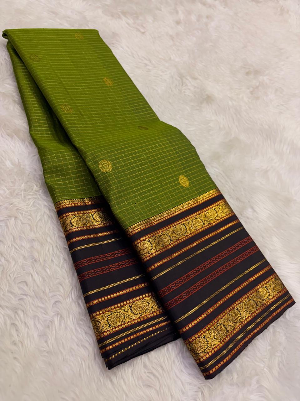 Olive green Kanjeevaram saree with Varisaipet weave and black gold peacock border — Idam Living