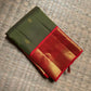 Olive Green Pure Silk Kanjivaram saree with gold-zari buttas.