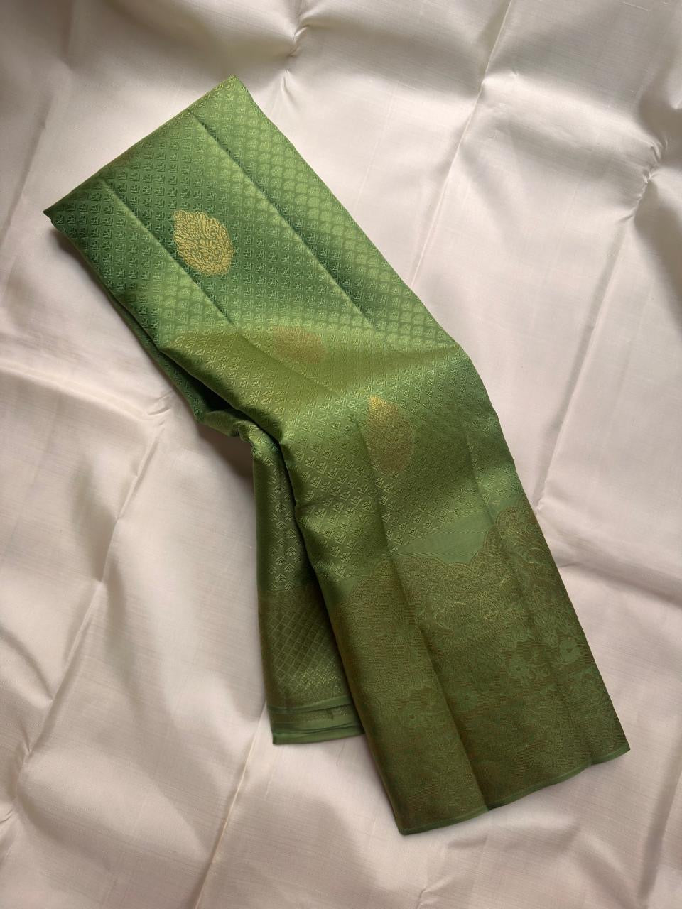 Olive green Kanjivaram saree with traditional Kanchipuram motifs, Idam Living
