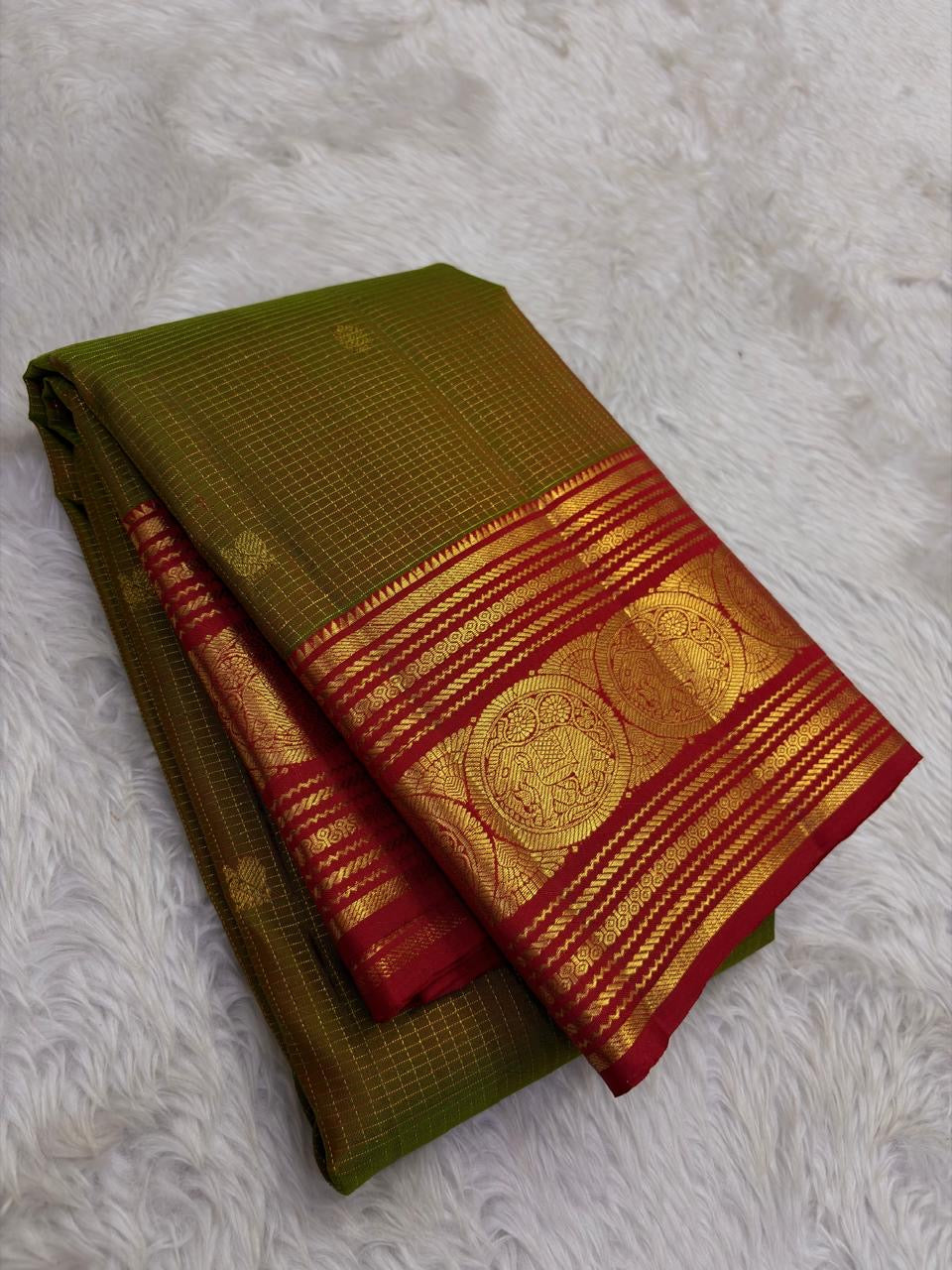 olive green Kanchipuram silk saree with zk-yb weave folded view
