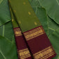 Olive green and maroon handwoven Kanchipuram pure silk saree photographed on banana leaf — Idam Living