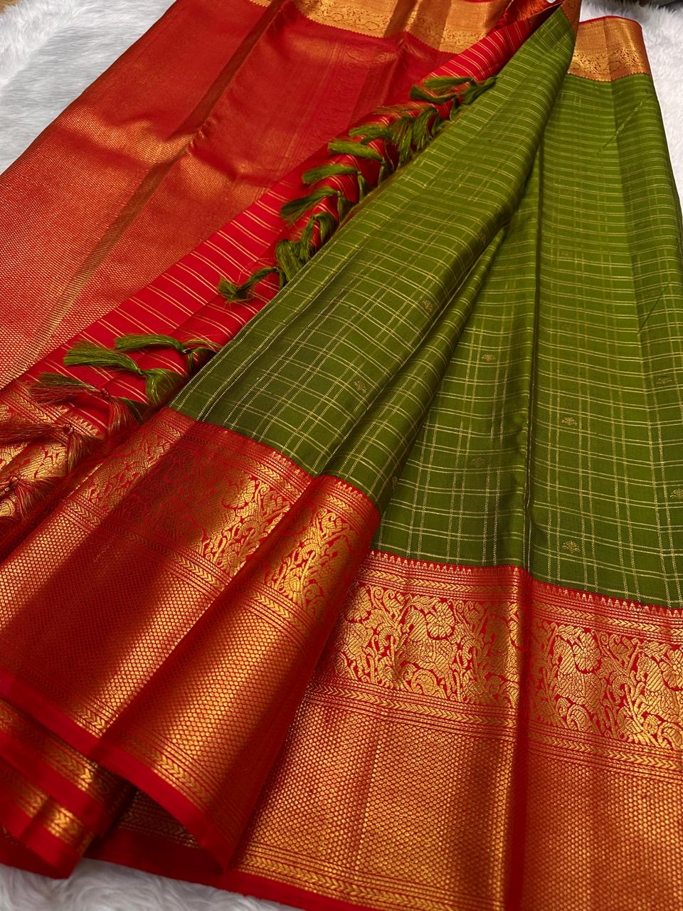 Olive Green pure silk Kanjivaram saree, Zari Kattam weave with Vermilion Gold Zari border — folded view