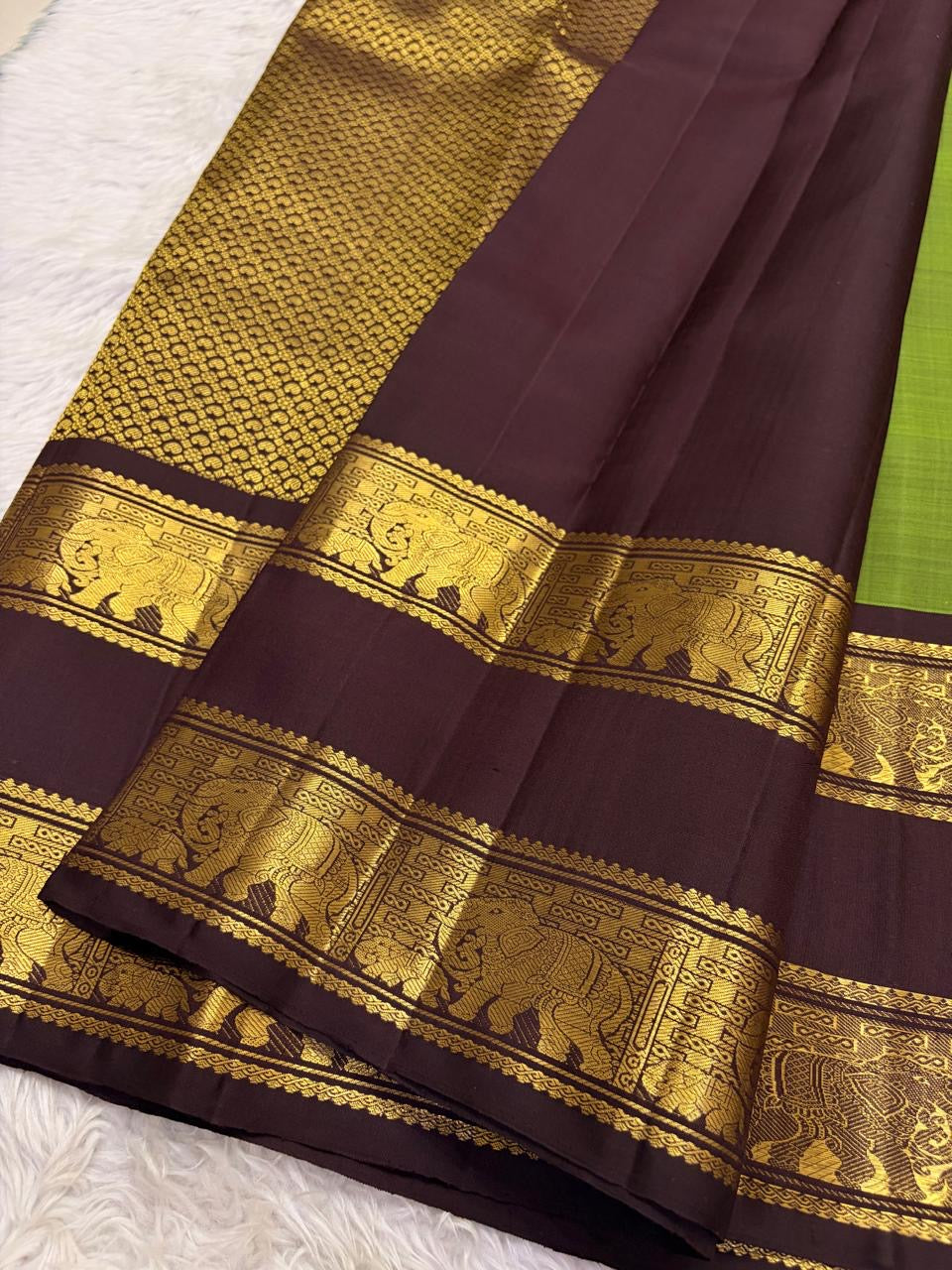 Deep aubergine Rettapet border with Gaja elephant zari weave close-up