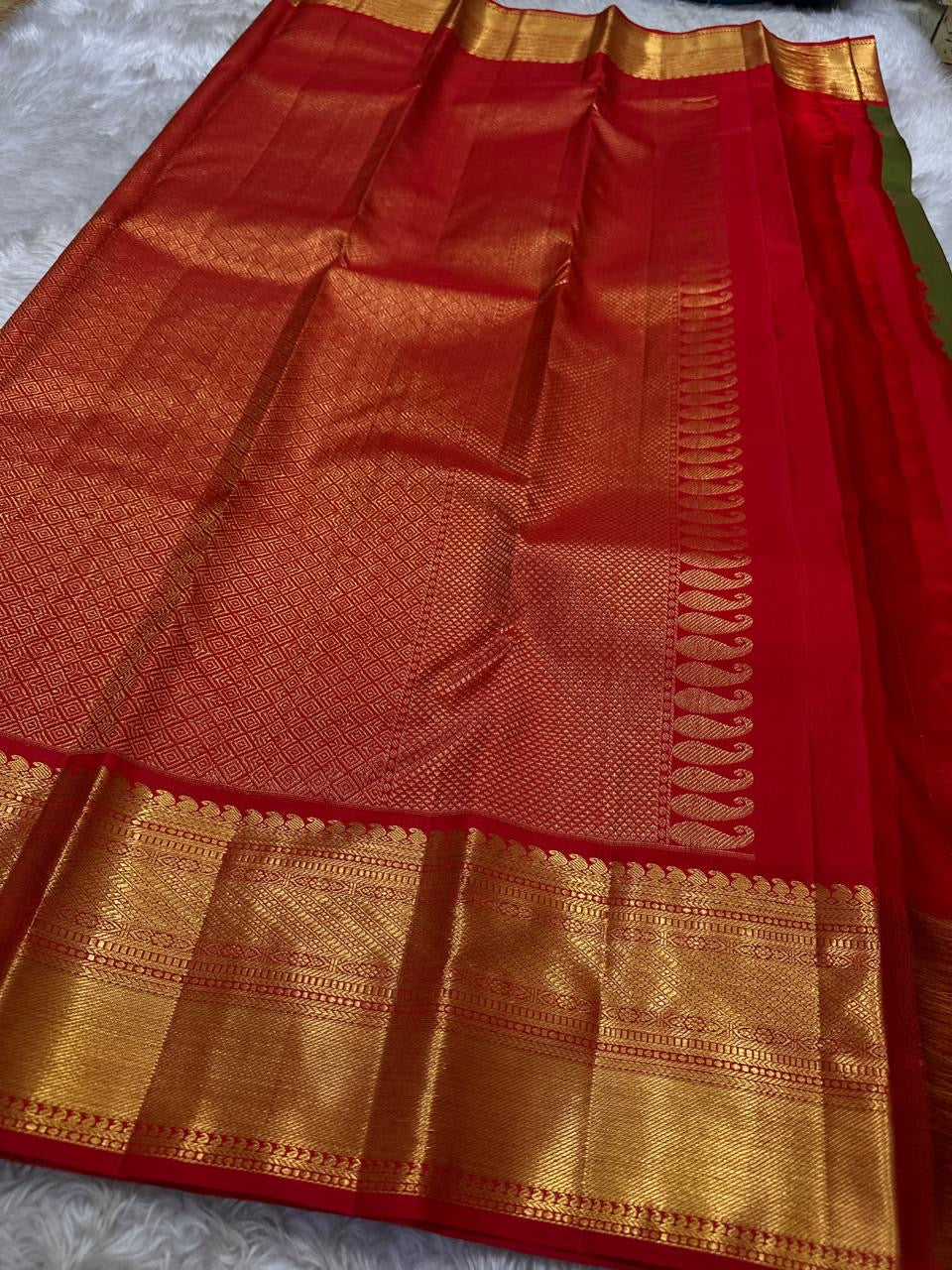 Olive Green Pure Silk Kanchipuram saree body with classic-gold zari buttas.