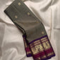 Handwoven Olive Green Kanchipuram silk saree with antique gold zari buttas