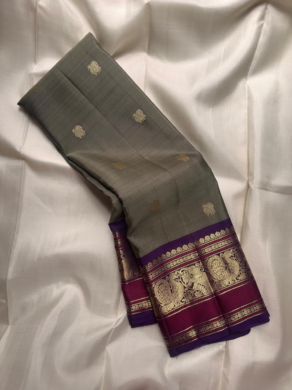 Handwoven Olive Green Kanchipuram silk saree with antique gold zari buttas