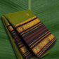 Pure Kanchipuram silk saree in olive green with charcoal black border and antique gold zari weaving