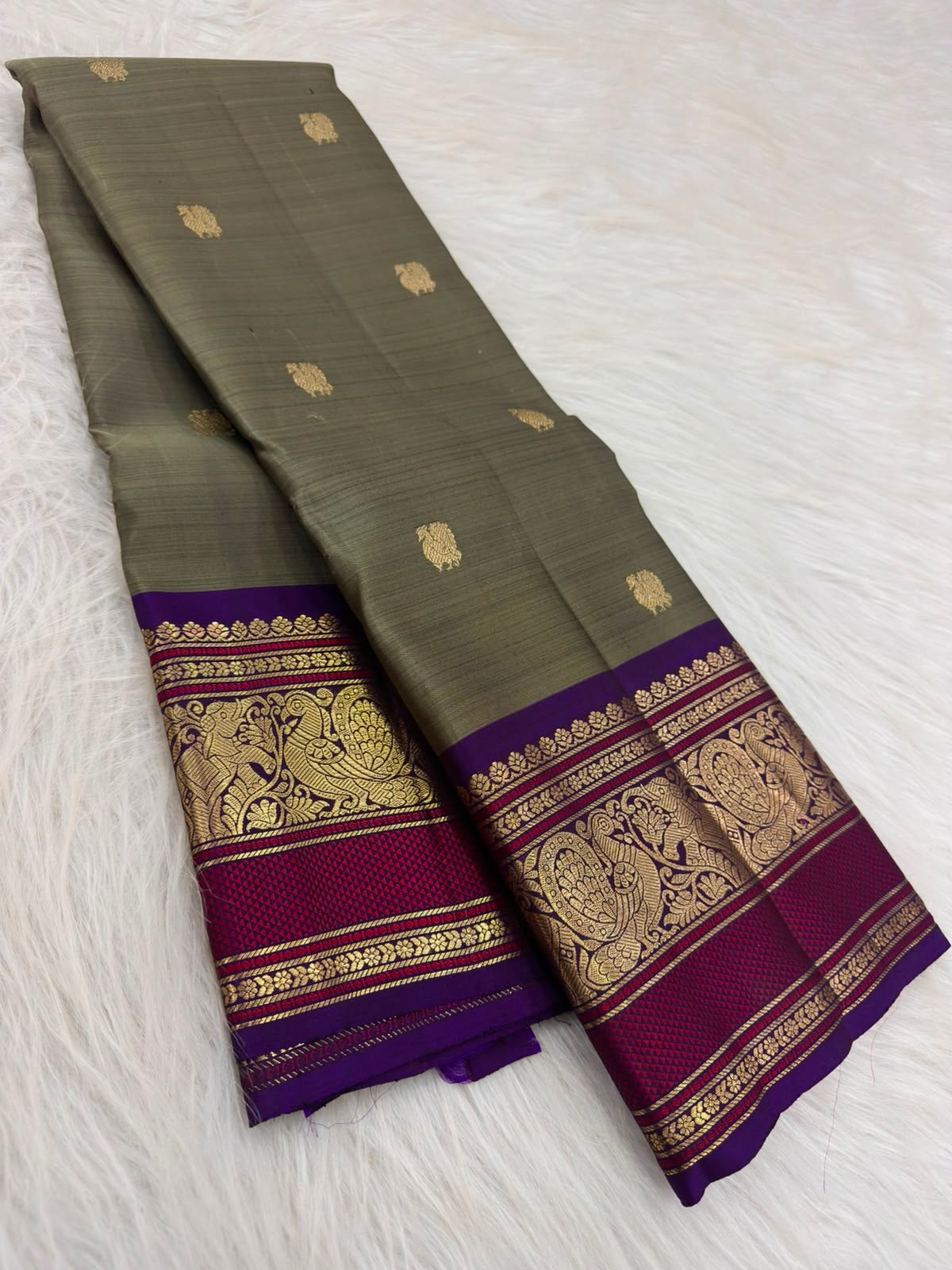 Olive Grey Kanchi Pattu Saree — body close-up showing scattered gold zari buttas