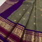 Olive Grey Kanchi Pattu Saree — royal-purple border with gold zari peacock and floral motifs