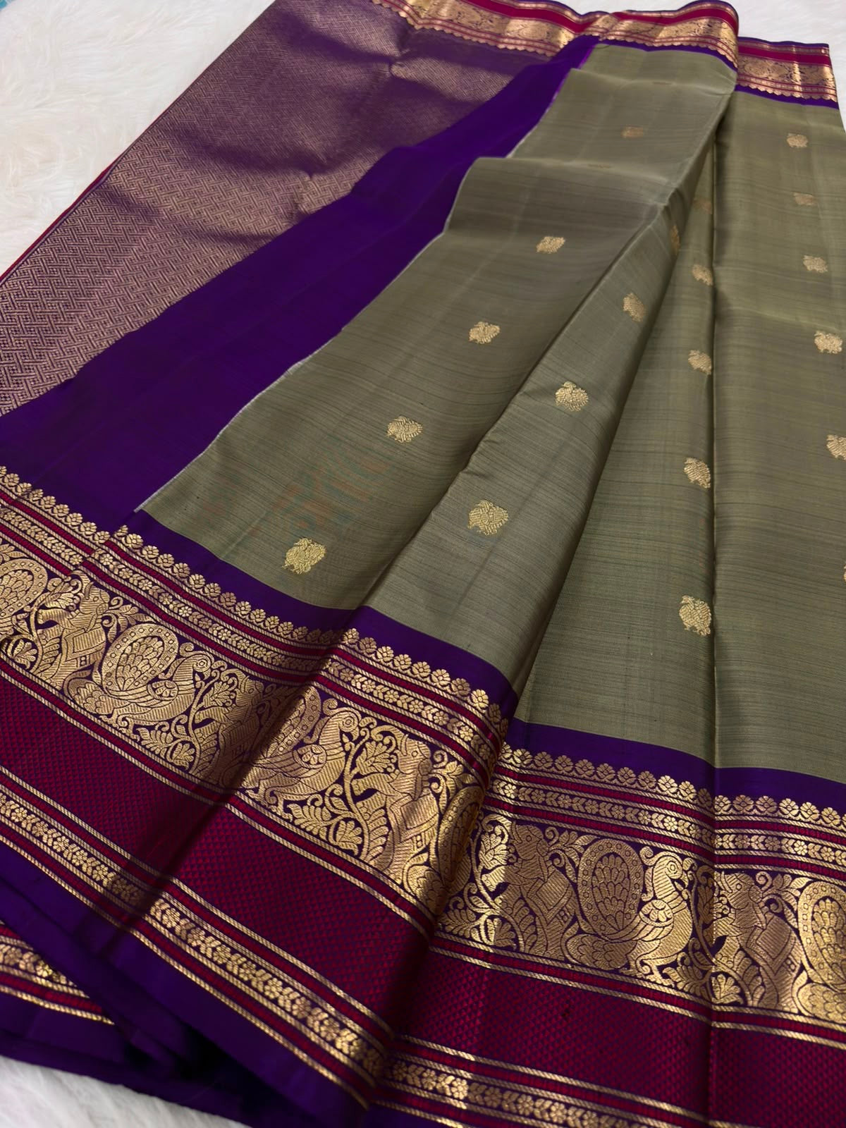Olive Grey Kanchi Pattu Saree — royal-purple border with gold zari peacock and floral motifs