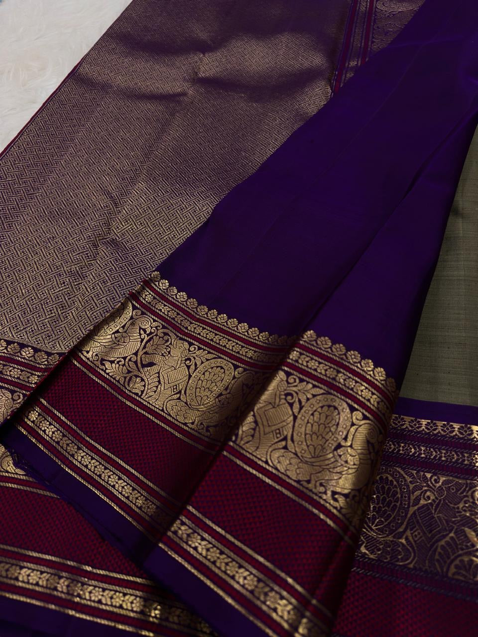 Handwoven Olive Grey Pure Silk Kanchipuram Butta saree with petite traditional gold zari buttas.