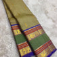 Sage olive Kanjivaram Rettapet saree — antique-gold zari elephant border motif close-up