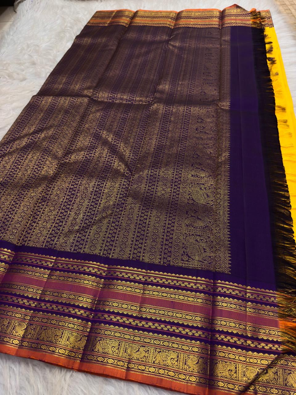 Stacked Varisaipet zari border showing Mayil Kann and Thazhampoo Reku patterns on yellow silk