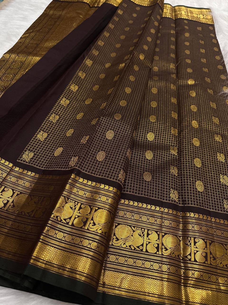 Deep brown lightweight handwoven pure silk Kanjivaram saree with Zari Kattam body Mayil Chakram butta and ornate antique gold zari border overview