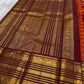 Magenta and black Varisaipet border with elephant procession and floral zari bands in antique gold