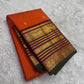 Orange Kanchipuram saree folded to show contrast magenta and black Varisaipet border