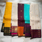 Kanchana Brown and orange pure silk saree showing broad gold zari peacock border.