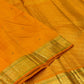 Kesari Orange Handwoven Pure Silk Kanjipuram Butta Saree with Green-Edged Gold Zari Border